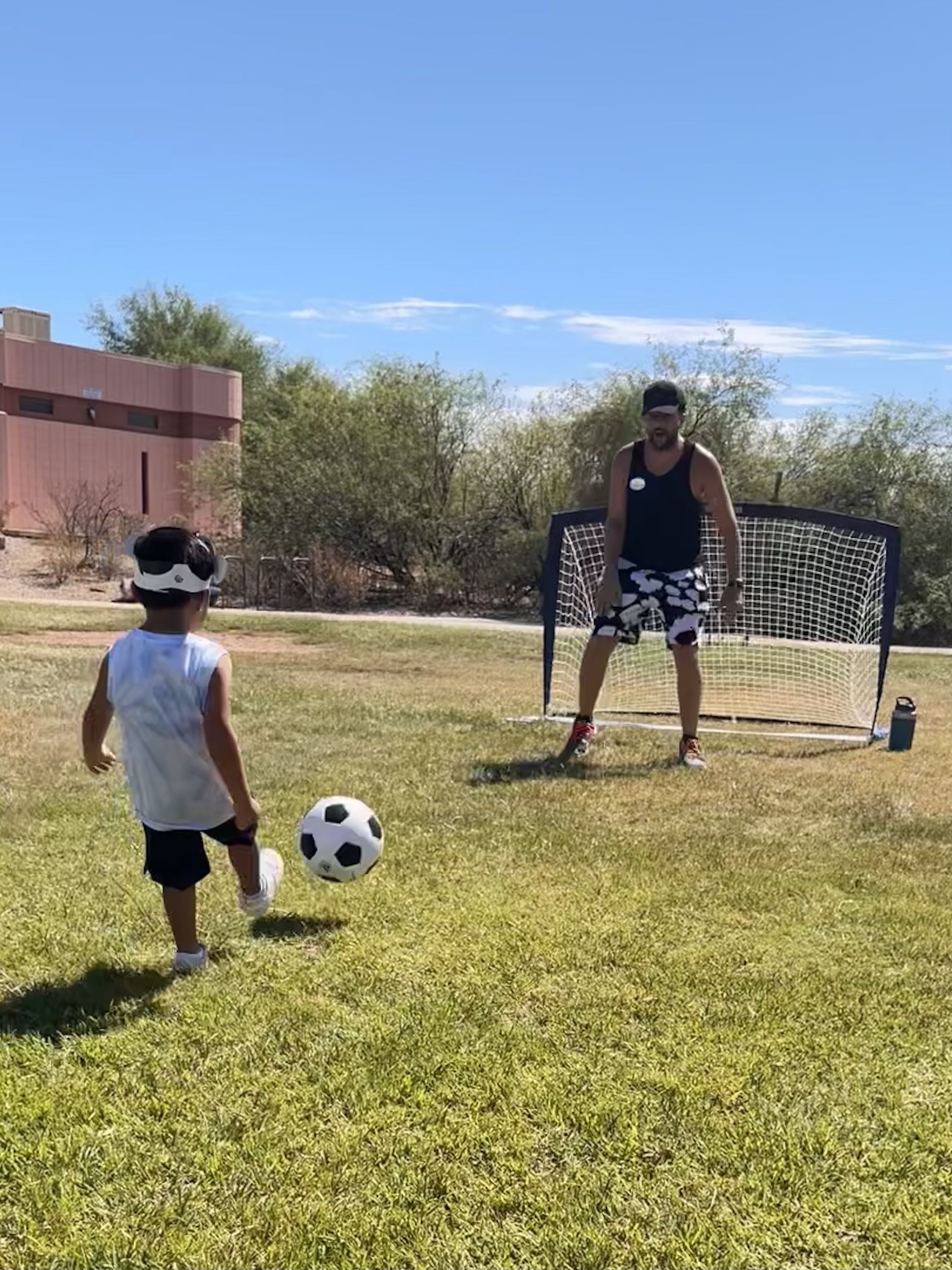 Seth Wilson playing soccer with his son